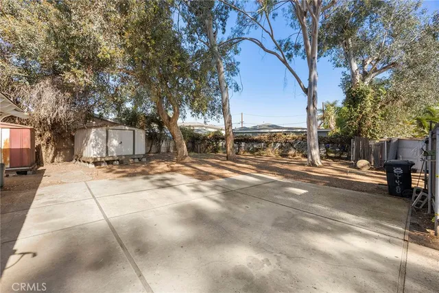 a backyard of a house with lots of tree