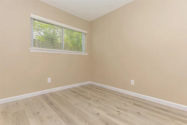 a kitchen with granite countertop a sink stainless steel appliances and cabinets