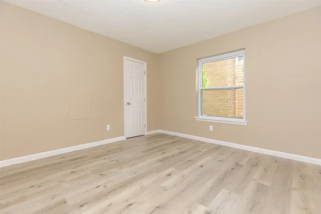 a bathroom with a granite countertop sink toilet and bathtub