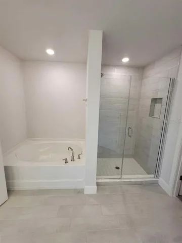 a large bathroom with a double vanity sink and a mirror