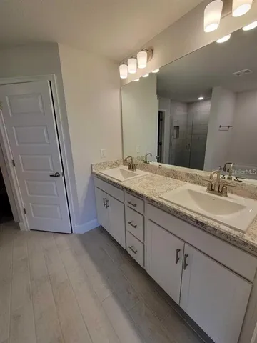 a spacious bathroom with a bathtub and a shower