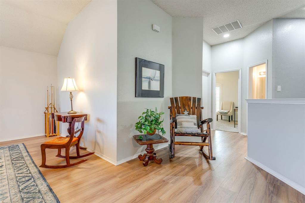 4816 Sleepy Ridge Circle Fort Worth, TX 76133 - Photo 21 of 36 Game room with light wood-style flooring and a high textured ceiling