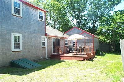 38 Bumpus Road Hyannis, MA 02601 - Photo 2 of 4 a front view of a house with a yard