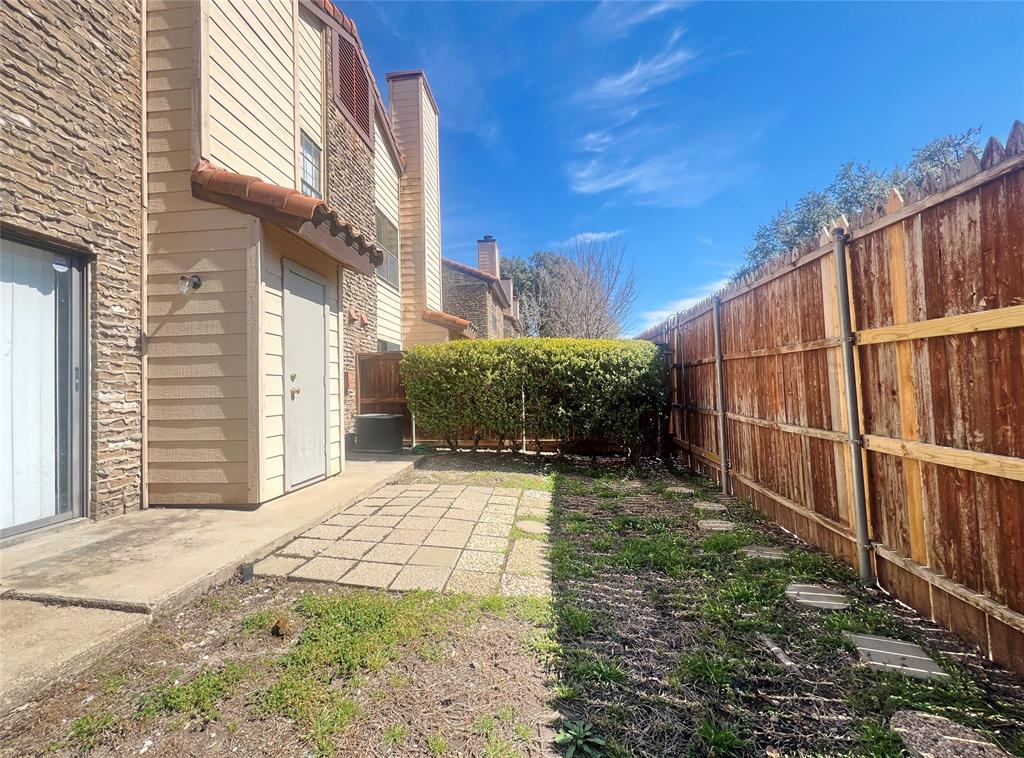 5626 Preston Oaks Road, Unit 43D Dallas, TX 75254 - Photo 9 of 9 a view of a backyard with pathway