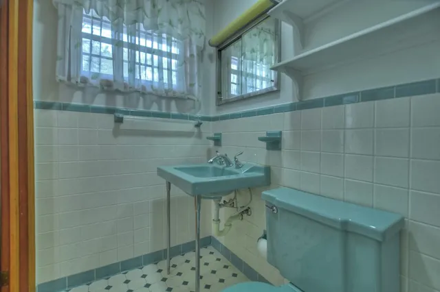 a bathroom with a sink a vanity and a mirror