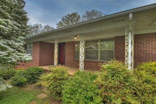 front view of a house with a garden