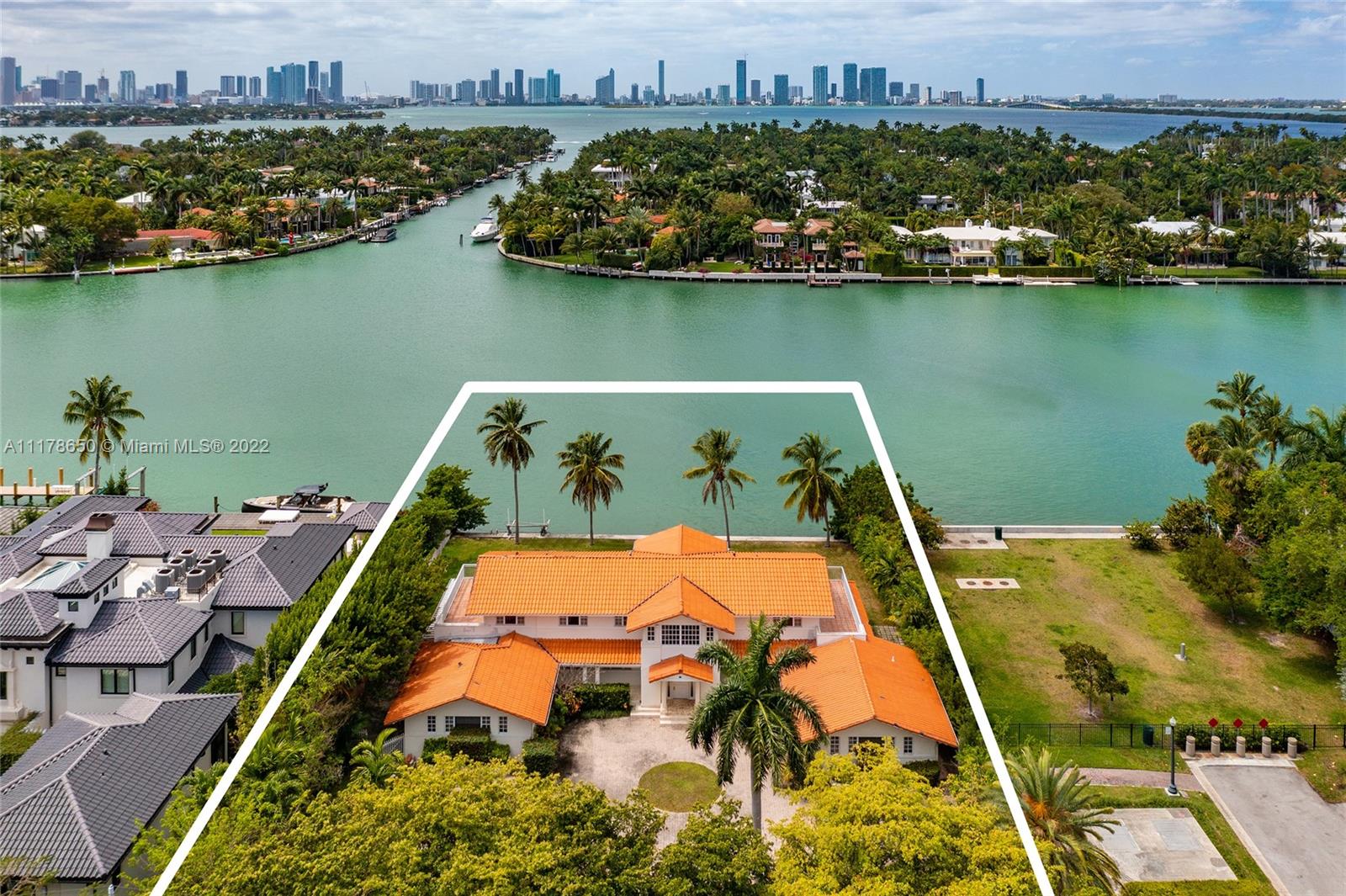 an aerial view of a house with a lake view