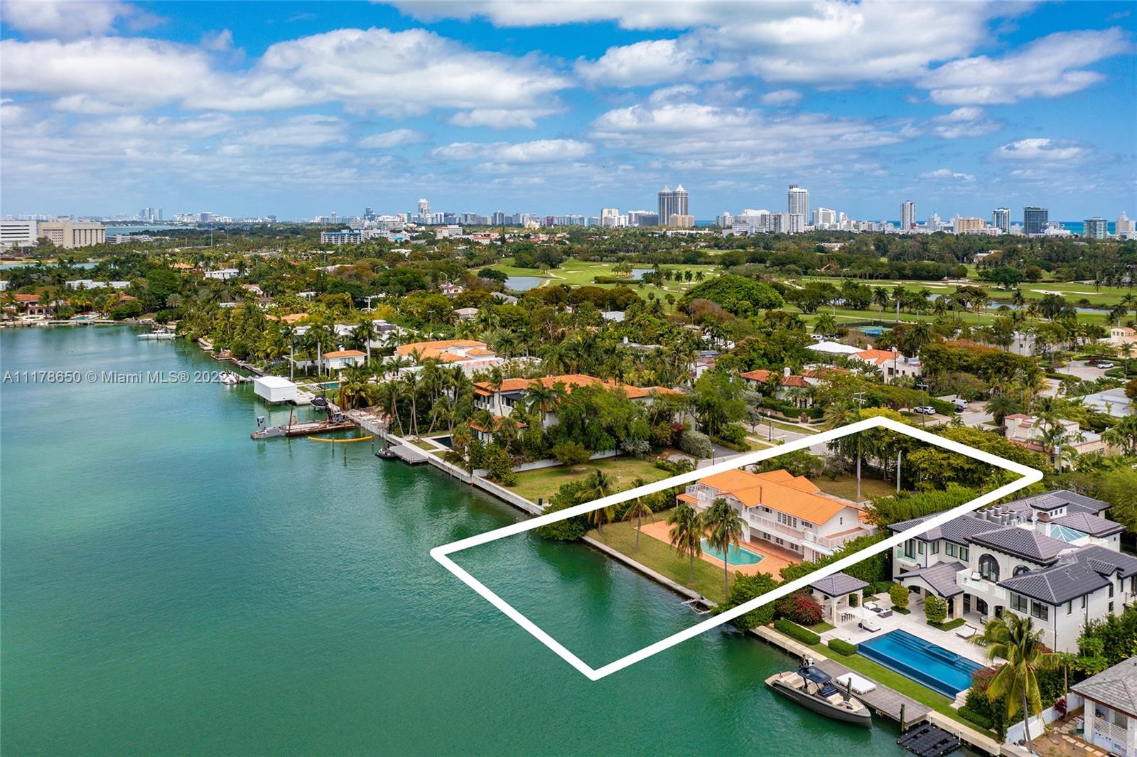 2220 North Bay Road Miami Beach, FL 33140 - Photo 3 of 9 a view of a pool with a lake