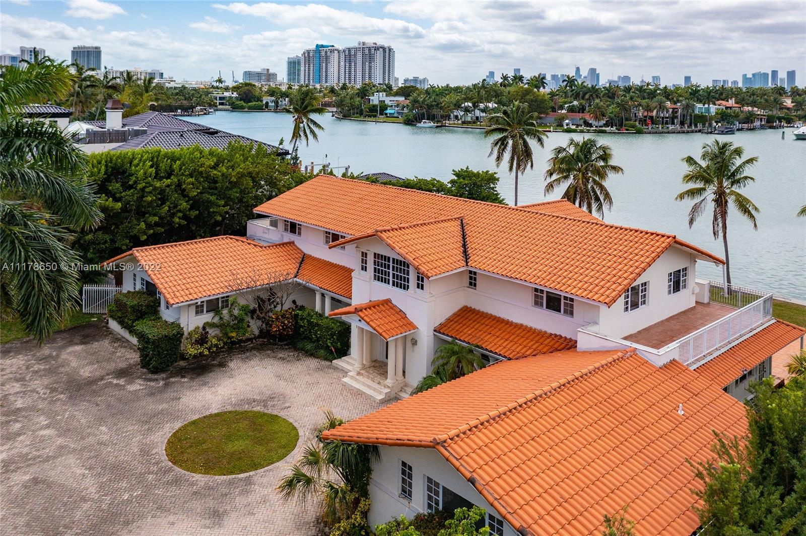 2220 North Bay Road Miami Beach, FL 33140 - Photo 9 of 9 an aerial view of a house with outdoor space and lake view in back