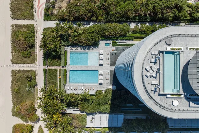 a room with lots of furniture and potted plants