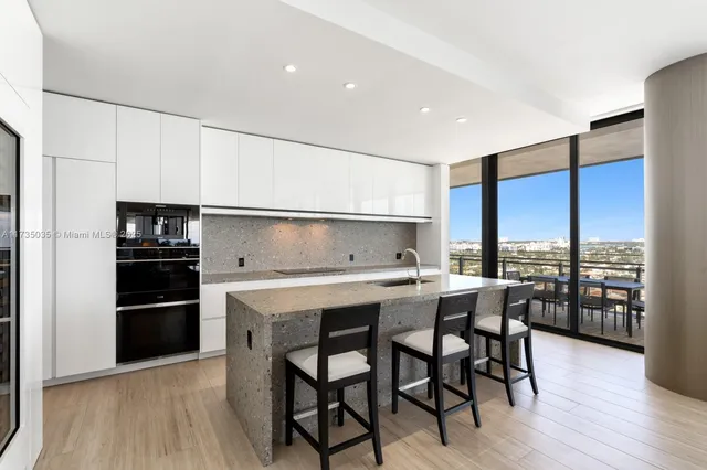 a very nice looking living room with a large window