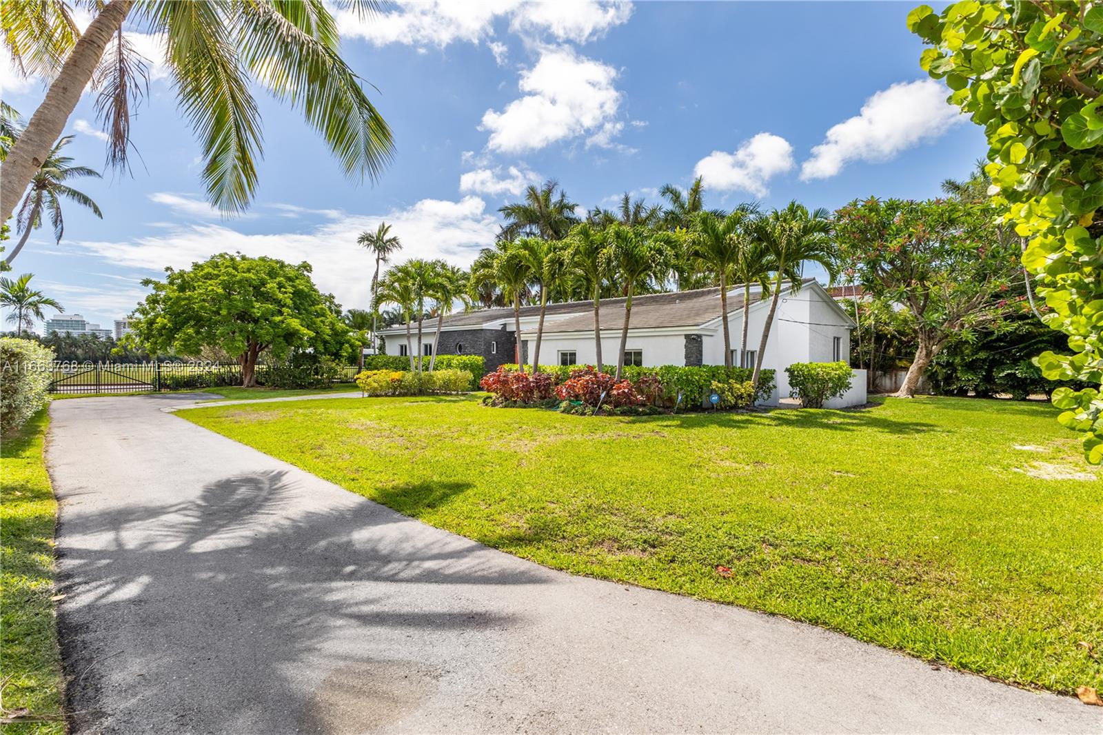 5785 Alton Road Miami Beach, FL 33140 - Photo 40 of 46 a view of a swimming pool with an outdoor space and seating area