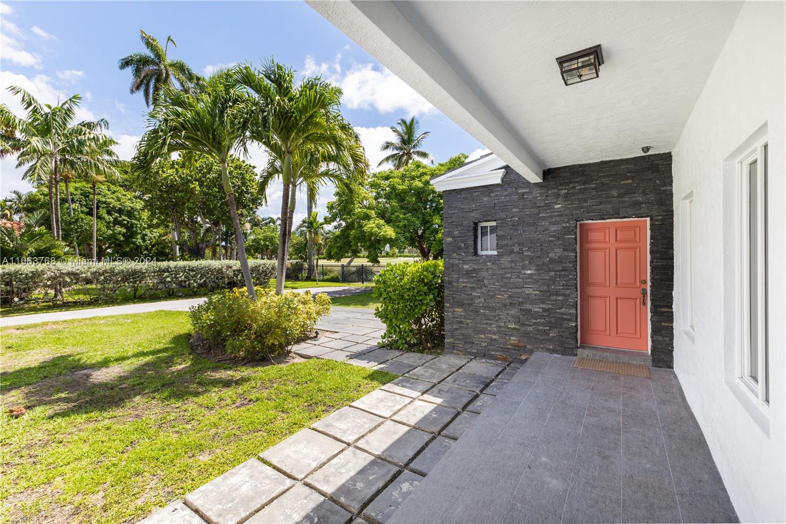 5785 Alton Road Miami Beach, FL 33140 - Photo 6 of 46 a view of a house with a yard
