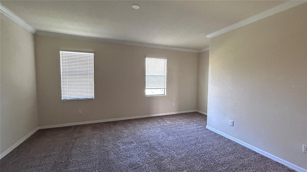 7287 Ketch Place Bradenton, FL 34212 - Photo 13 of 29 an empty room with windows