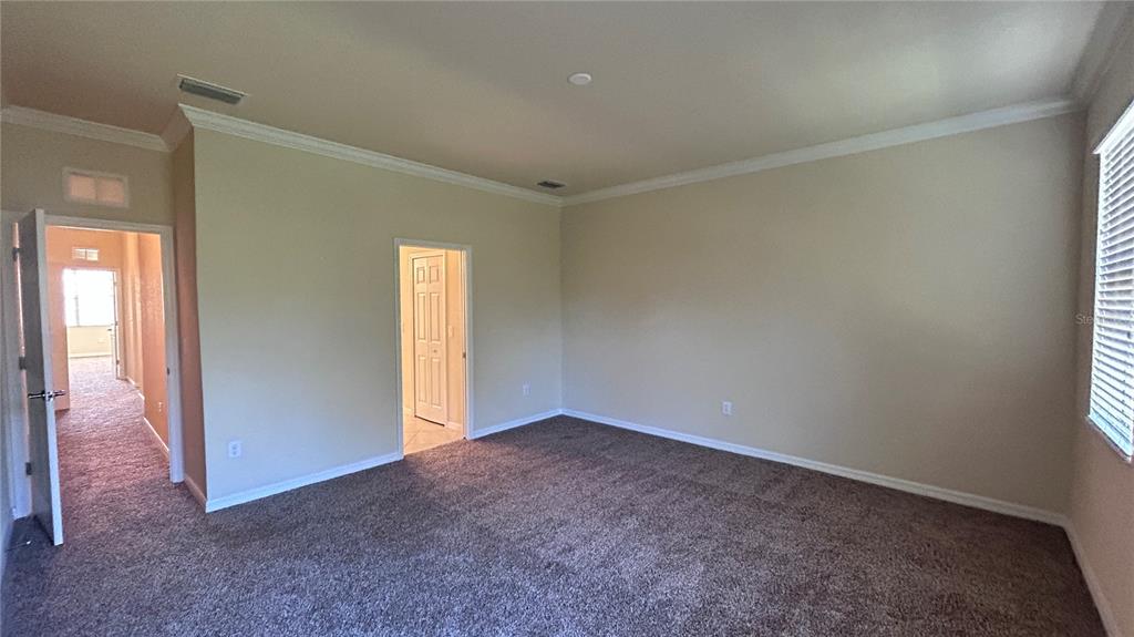 7287 Ketch Place Bradenton, FL 34212 - Photo 14 of 29 an empty room with windows