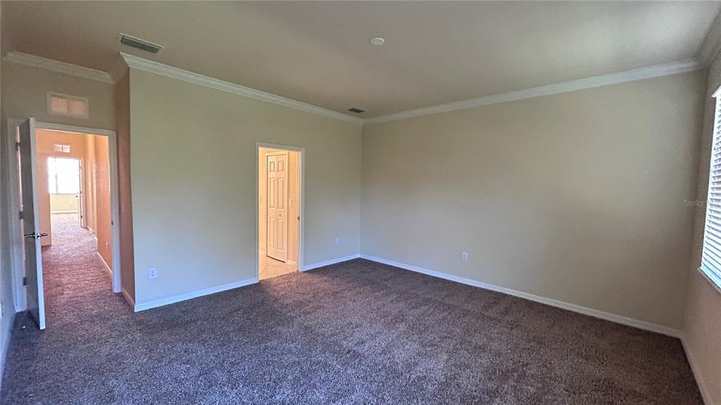 7287 Ketch Place Bradenton, FL 34212 - Photo 15 of 29 an empty room with windows
