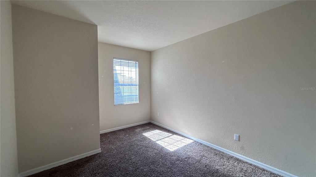 7287 Ketch Place Bradenton, FL 34212 - Photo 19 of 29 an empty room with a empty space and a window