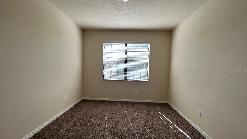 7287 Ketch Place Bradenton, FL 34212 - Photo 22 of 29 an empty room with a window