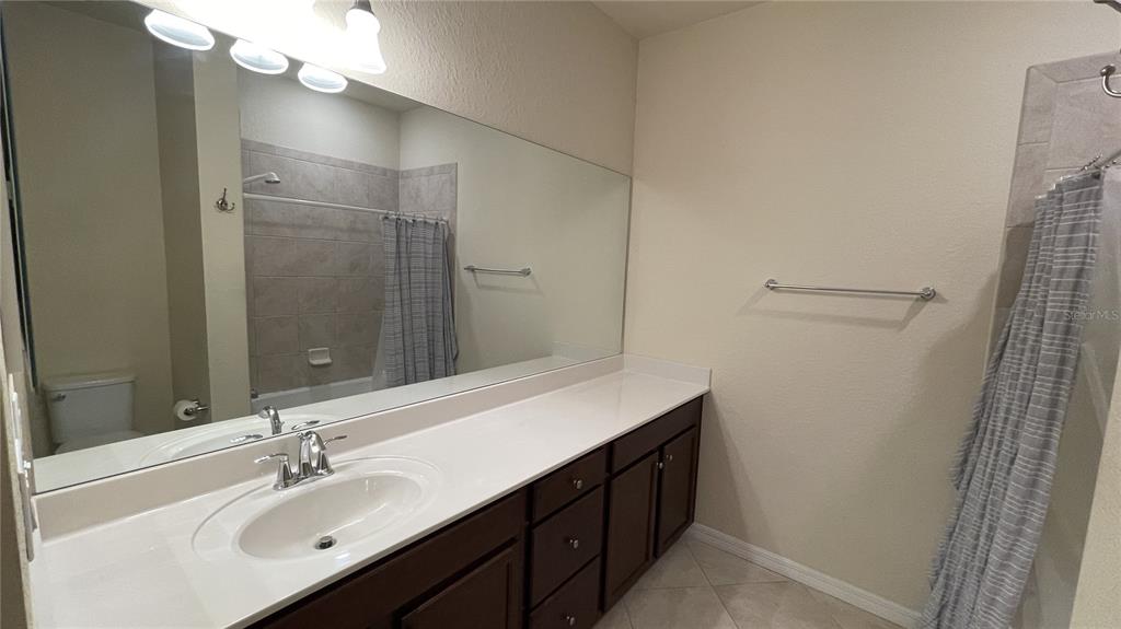 7287 Ketch Place Bradenton, FL 34212 - Photo 23 of 29 a bathroom with a sink and a mirror
