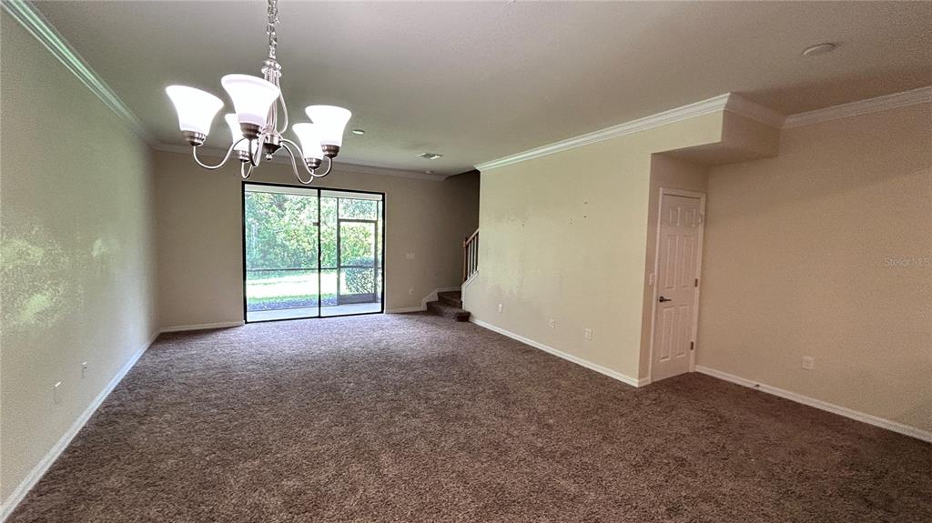 7287 Ketch Place Bradenton, FL 34212 - Photo 7 of 29 a view of a room with a chandelier