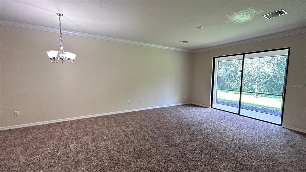 7287 Ketch Place Bradenton, FL 34212 - Photo 8 of 29 a view of an empty room with a window