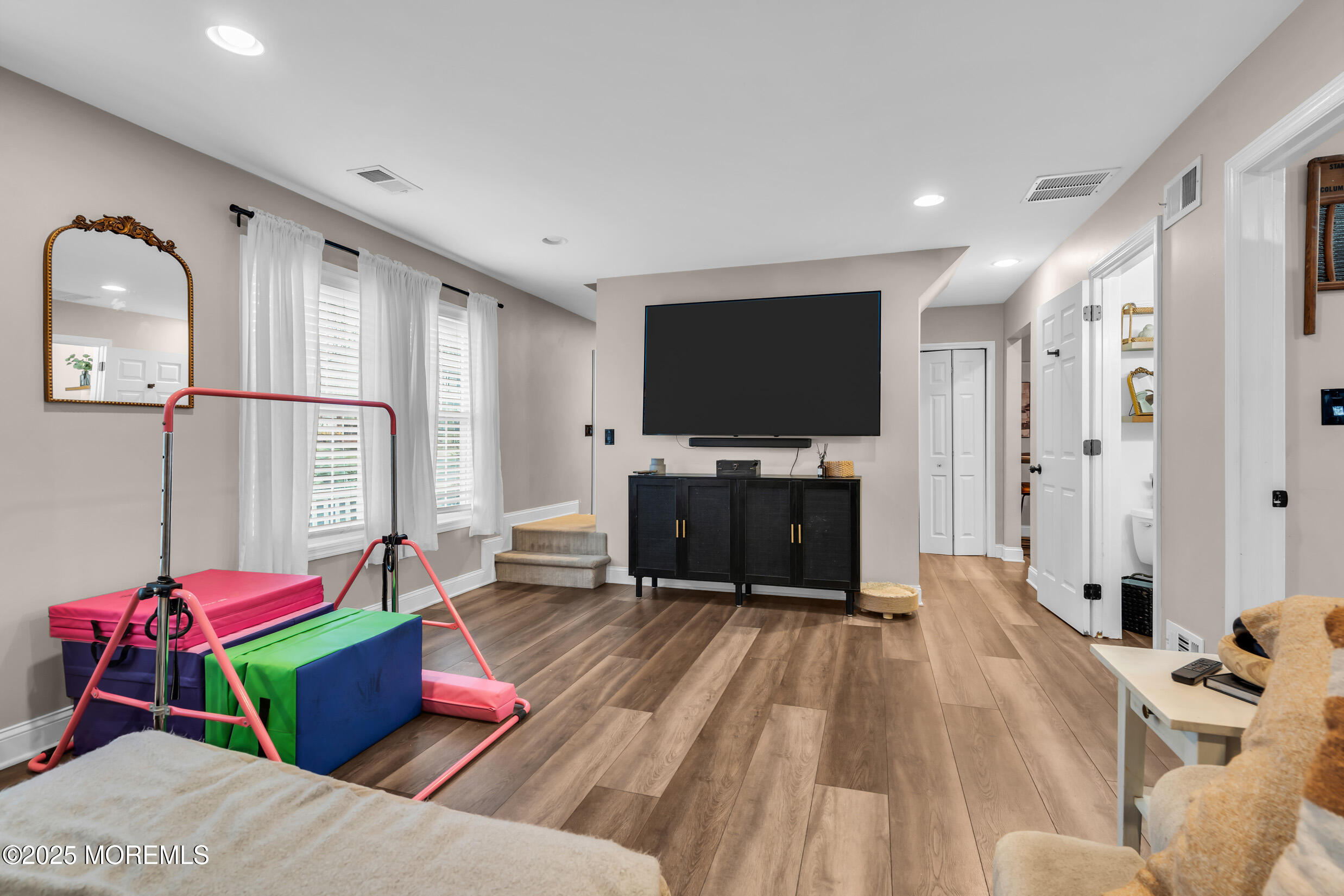 5 Sloop Court Barnegat, NJ 08005 - Photo 13 of 29 a living room with furniture and a flat screen tv