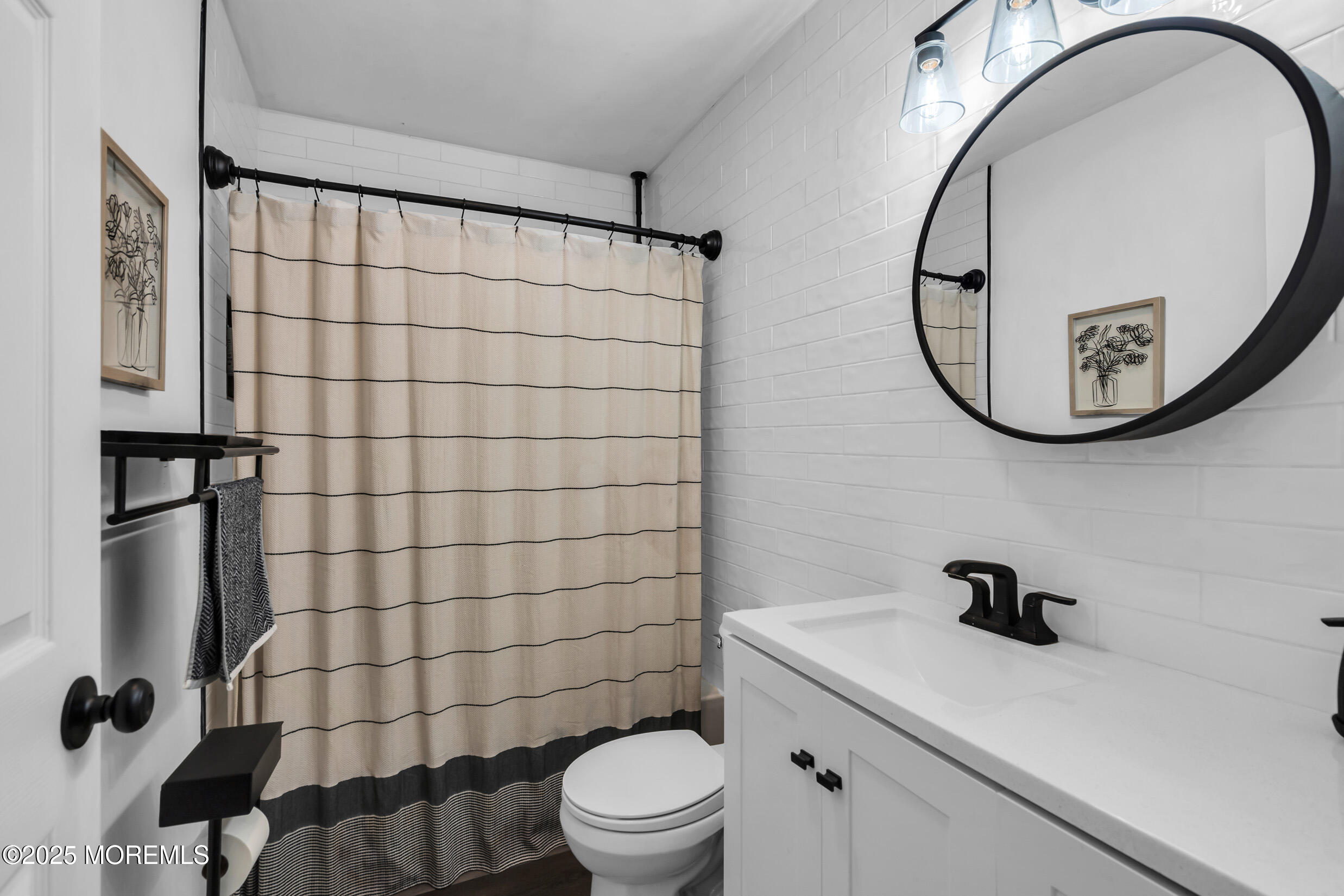 5 Sloop Court Barnegat, NJ 08005 - Photo 17 of 29 a bathroom with a sink toilet and a mirror