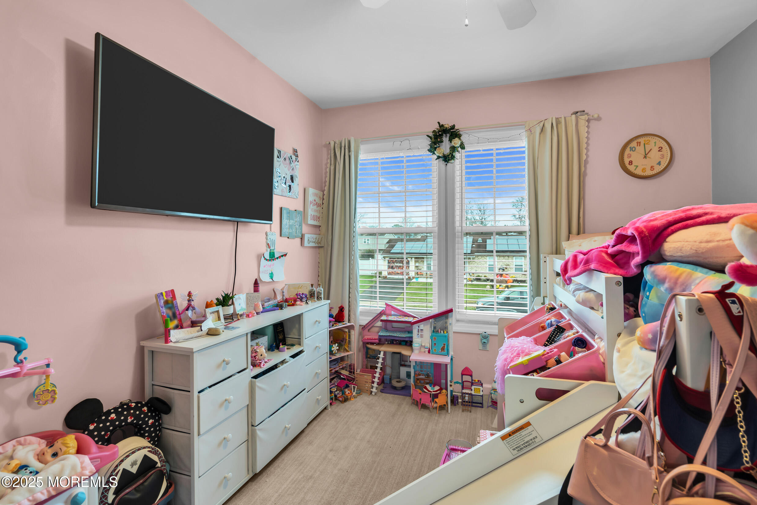 5 Sloop Court Barnegat, NJ 08005 - Photo 21 of 29 a living room with furniture a flat screen tv and a floor to ceiling window