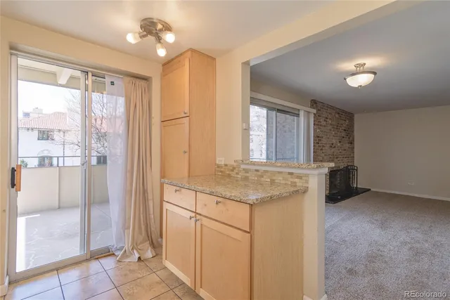 a kitchen with a stove a sink and a refrigerator