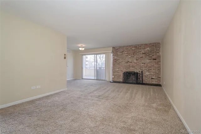 an empty room with fireplace