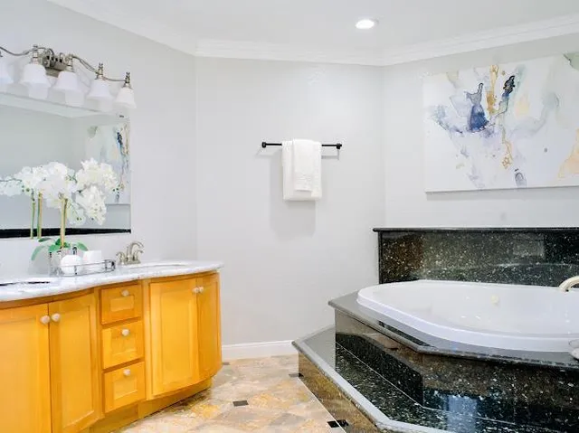 a bathroom with a tub and sink