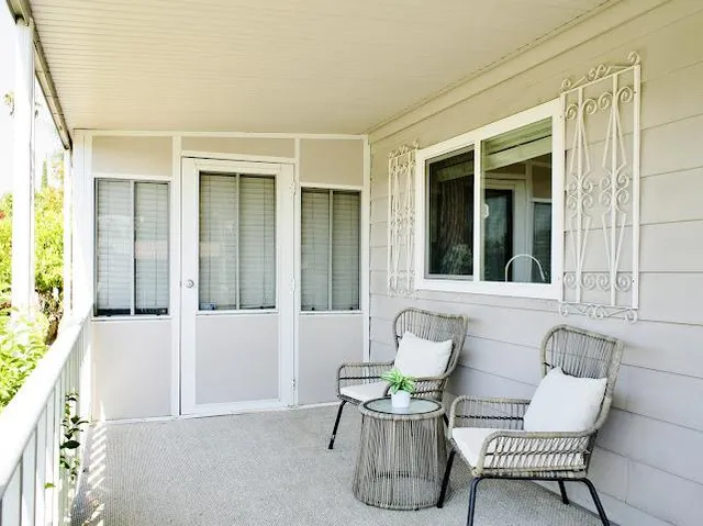 a balcony with furniture and window