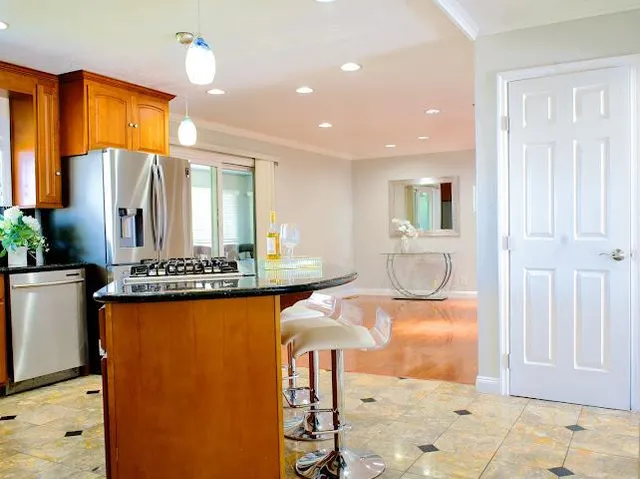 a view of a bathroom with dual sinks