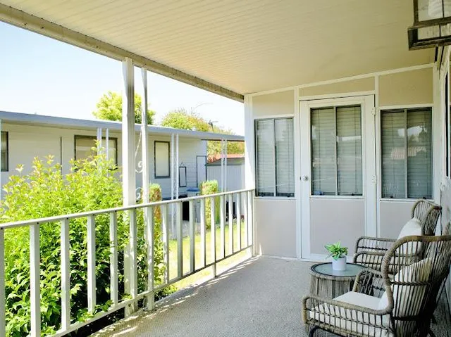 a view of a balcony with chair