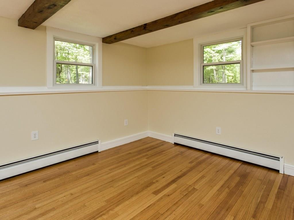 33 Skillin Road Cumberland, ME 04021 - Photo 14 of 32 The living room has exposed beams...