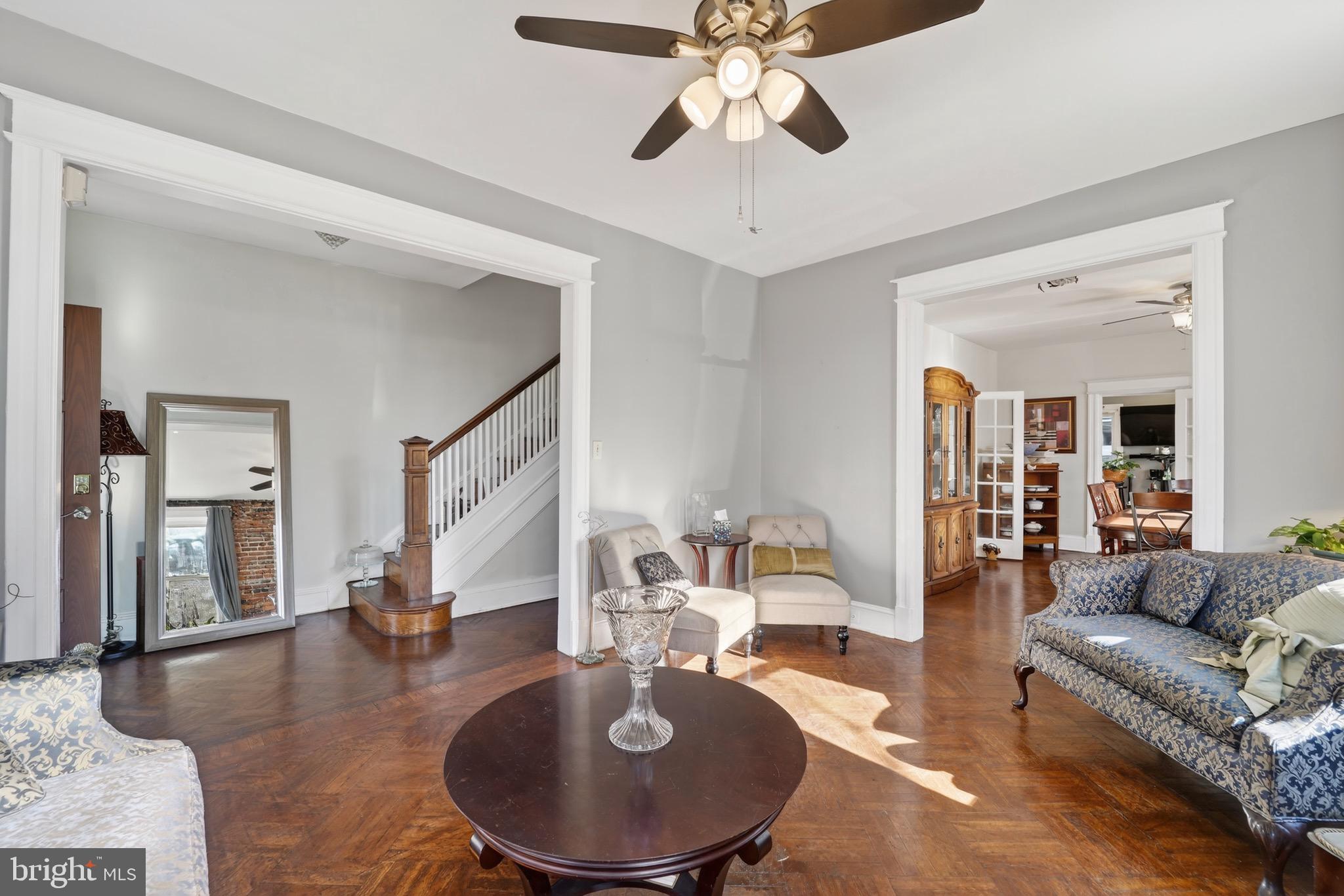 4301 4th Street Northwest Washington, DC 20011 - Photo 11 of 64 a living room with furniture and a chandelier