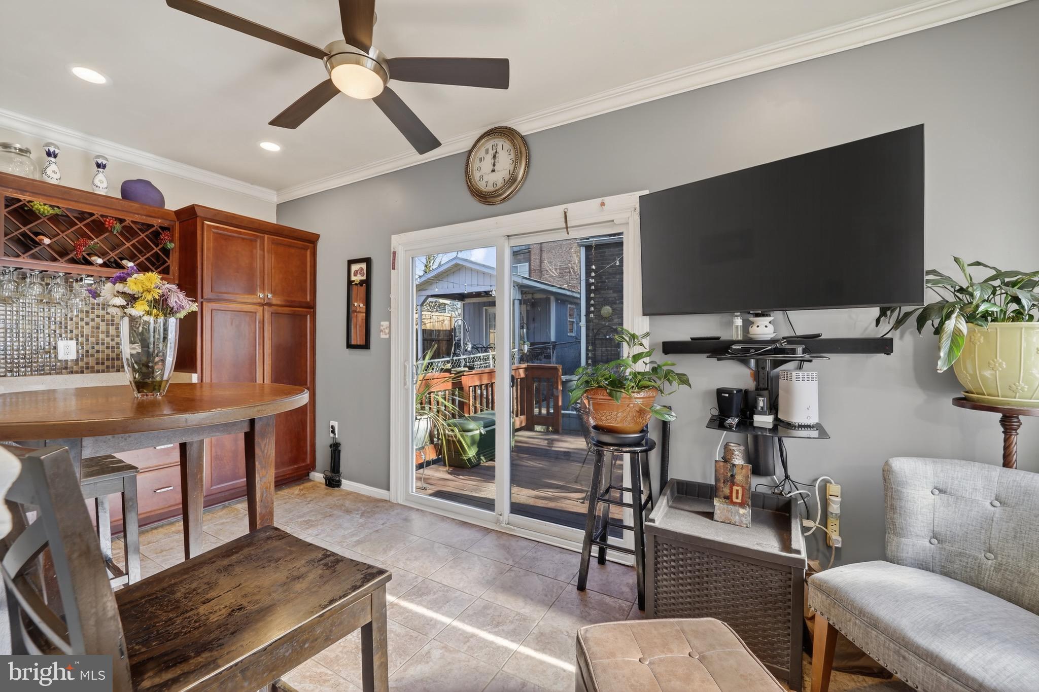 4301 4th Street Northwest Washington, DC 20011 - Photo 15 of 64 a living room with furniture a flat screen tv and kitchen view