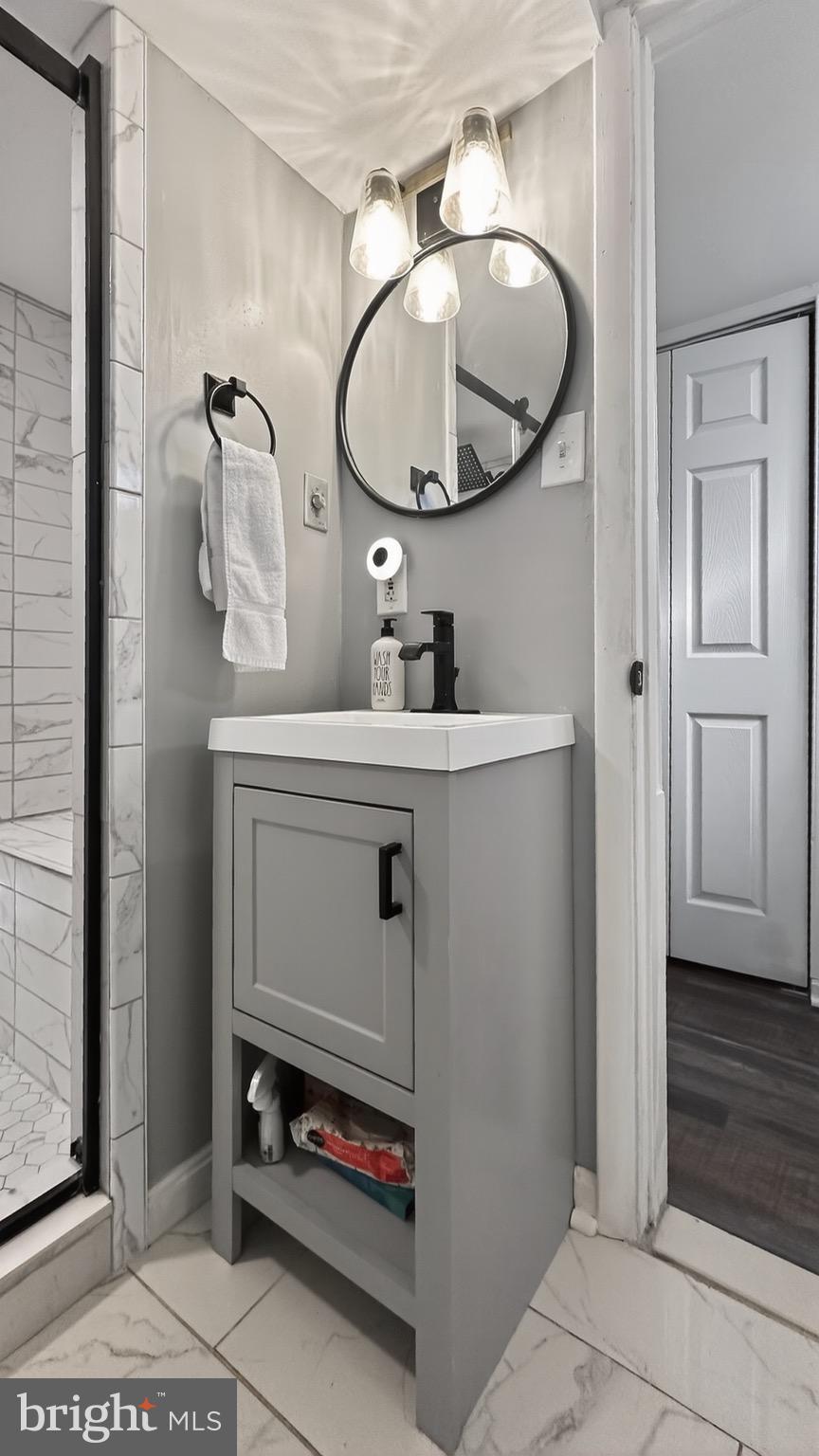 4301 4th Street Northwest Washington, DC 20011 - Photo 47 of 64 a bathroom with a sink and a mirror