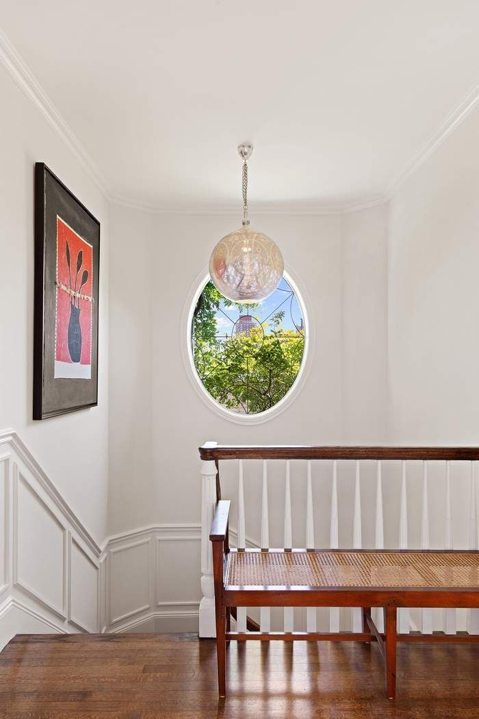 1158 5th Avenue, Unit PHC Manhattan, NY 10128 - Photo 13 of 25 a front view of a house with a wooden floor