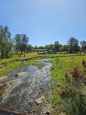 a view of a lake with houses in the back