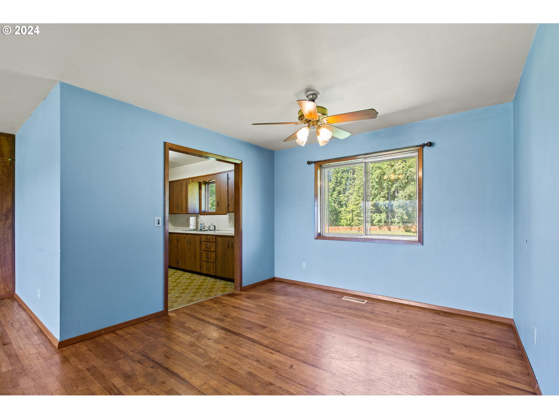 30806 South Oswalt Road Colton, OR 97017 - Photo 26 of 42 a view of an empty room with window and wooden floor
