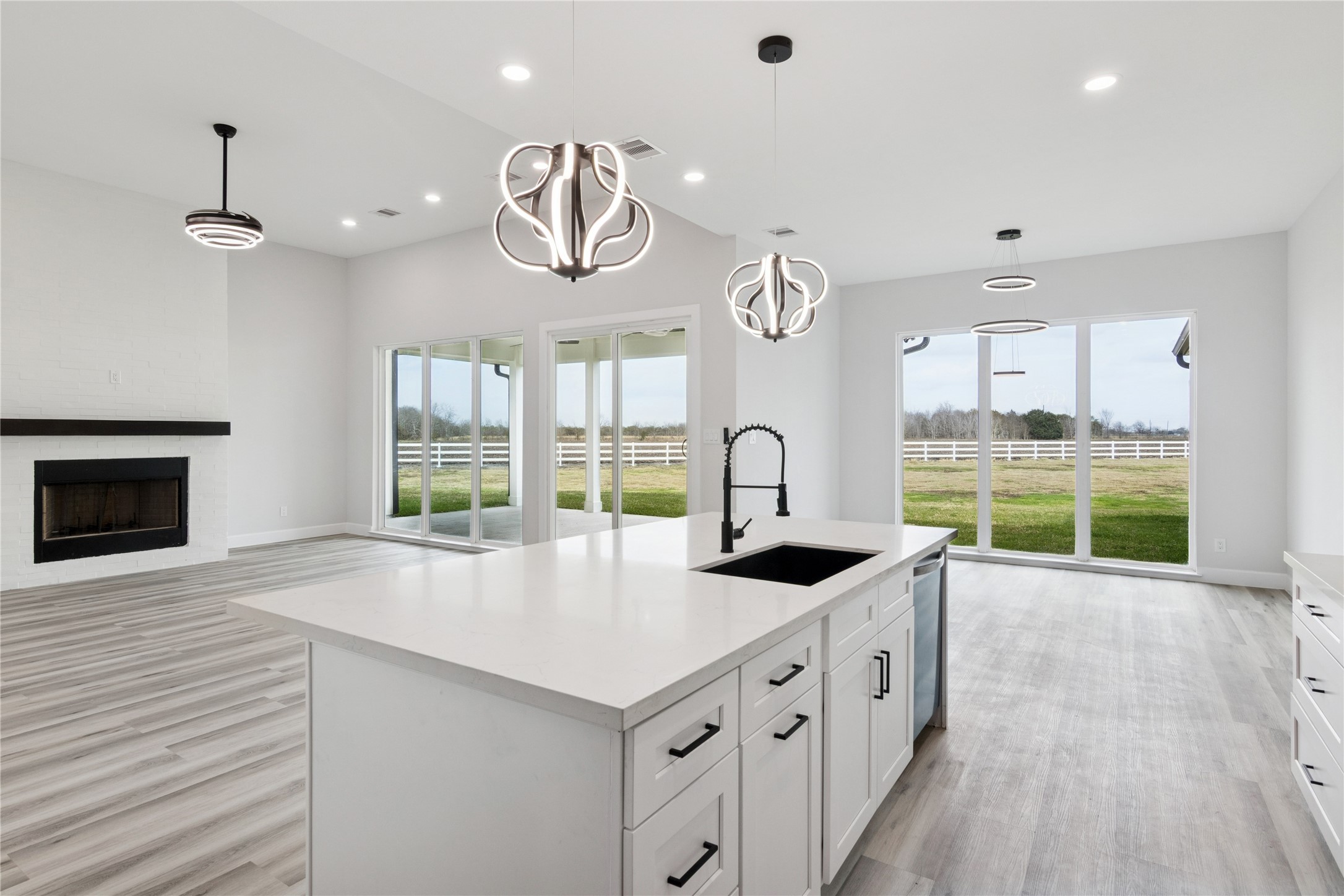 5766 Ward Bend Road Sealy, TX 77474 - Photo 17 of 45 a kitchen with granite countertop a sink a counter top space and stainless steel appliances
