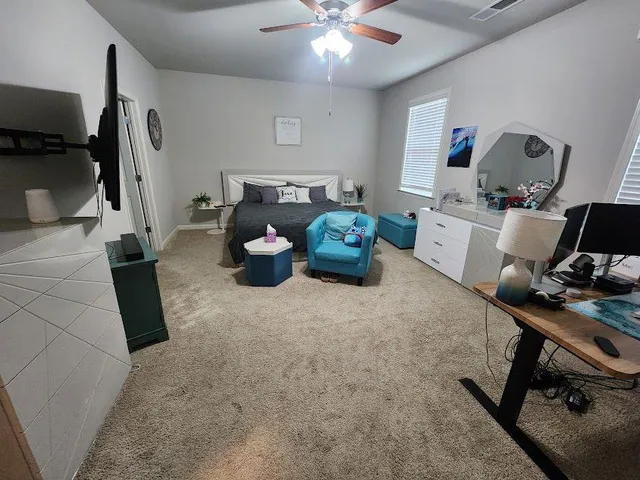 a room with furniture and a flat screen tv