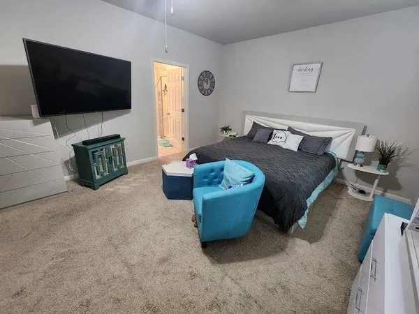 a bed room with a bed and a window