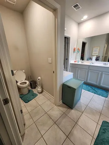 a kitchen with a refrigerator and a stove