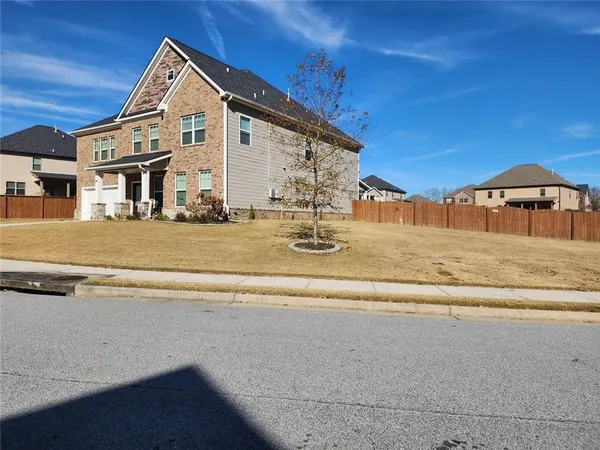 a view of a house with a yard