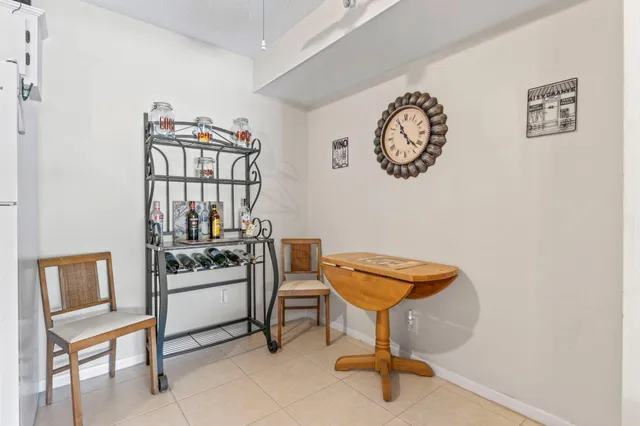 a bedroom with a bed and a night stand