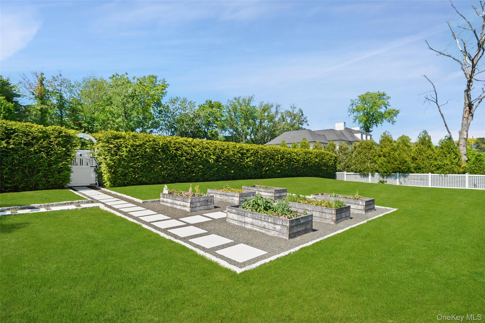 27 Murray Hill Road Scarsdale, NY 10583 - Photo 24 of 29 a view of a big yard with a table and chair