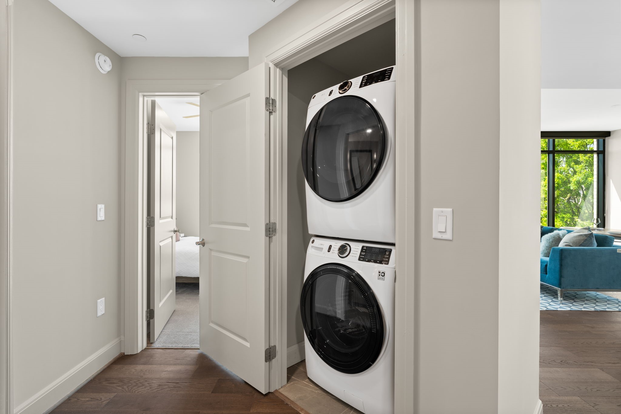 2511 Willowick Road, Unit 317 Houston, TX 77027 - Photo 20 of 44 a view of a hallway with washer and dryer