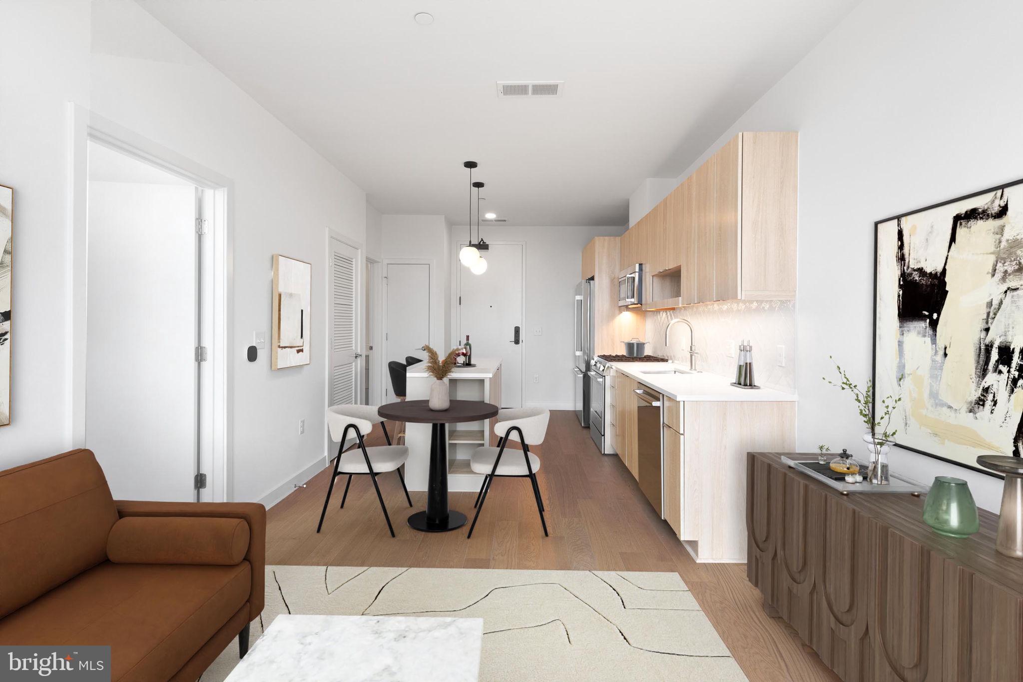 7175 12th Street Northwest, Unit 607 Washington, DC 20012 - Photo 1 of 25 a living room with furniture a dining table and kitchen view